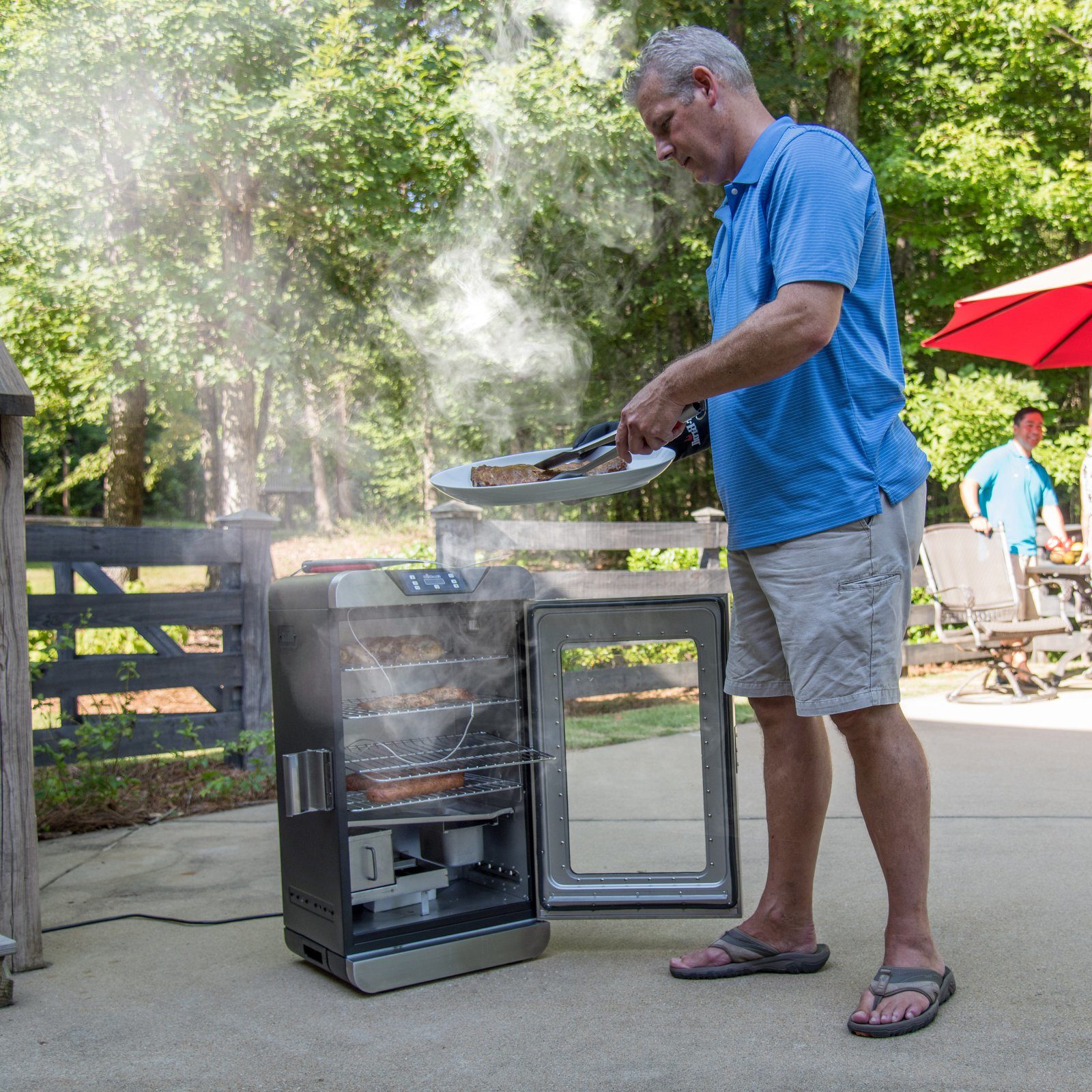 David cooking with his new electric smoker grill.