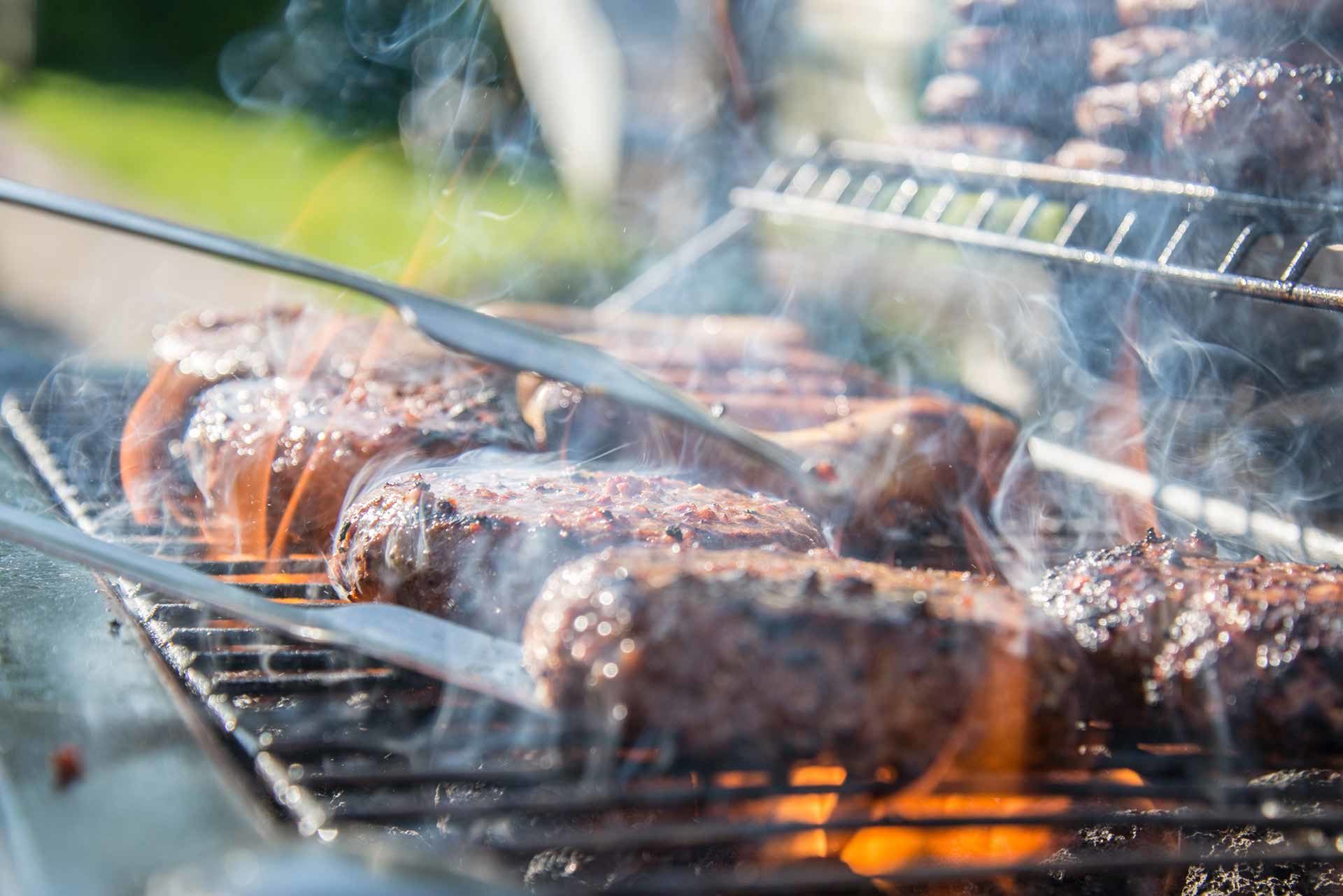 Family man cooking hamburgers.