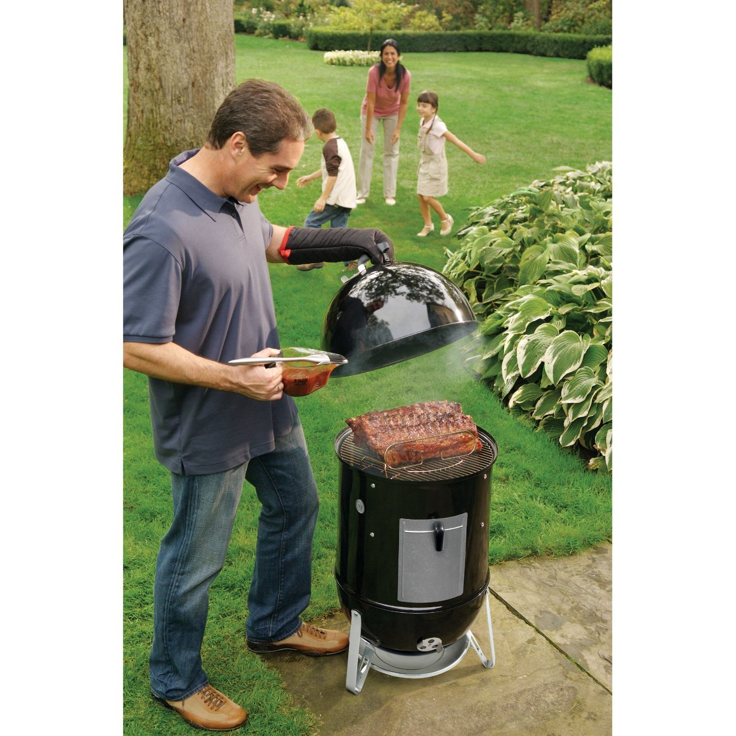 James cooking with his family in his new charcoal smoker.