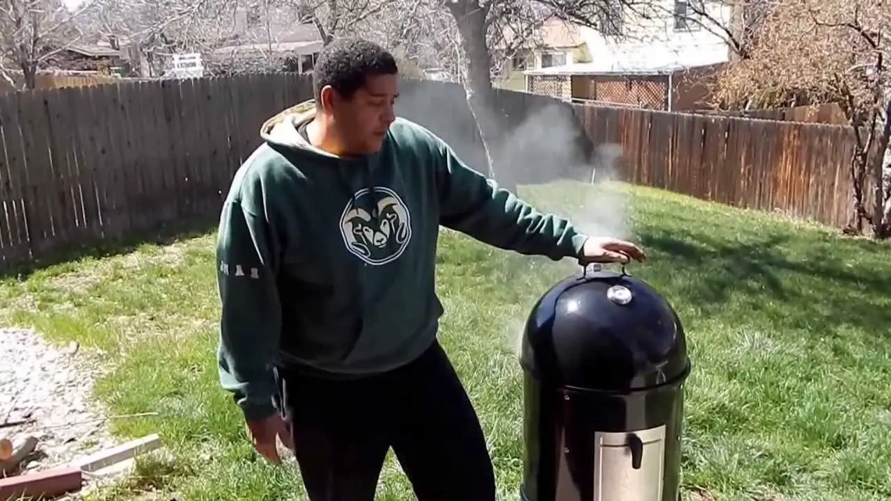 Jordan using his new Weber Smoker.