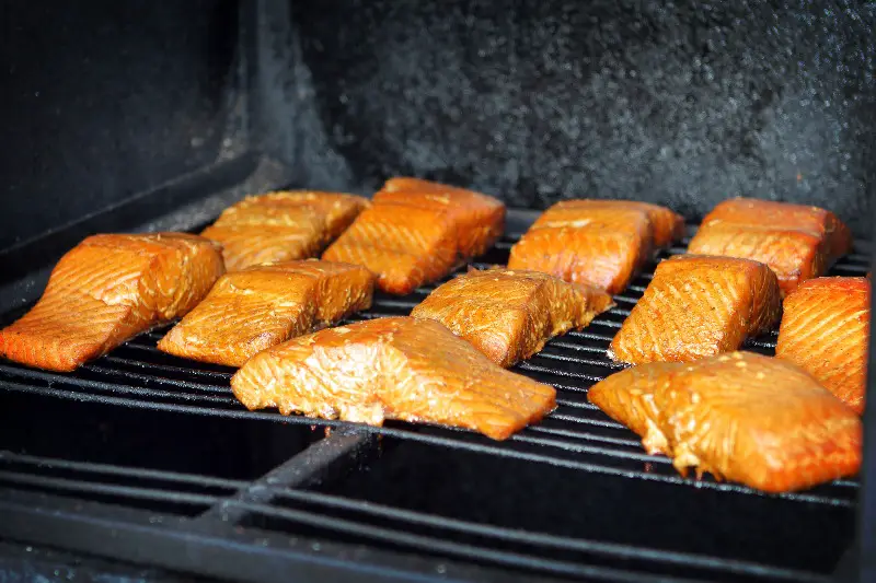 Fresh smoked salmon in smoker grill