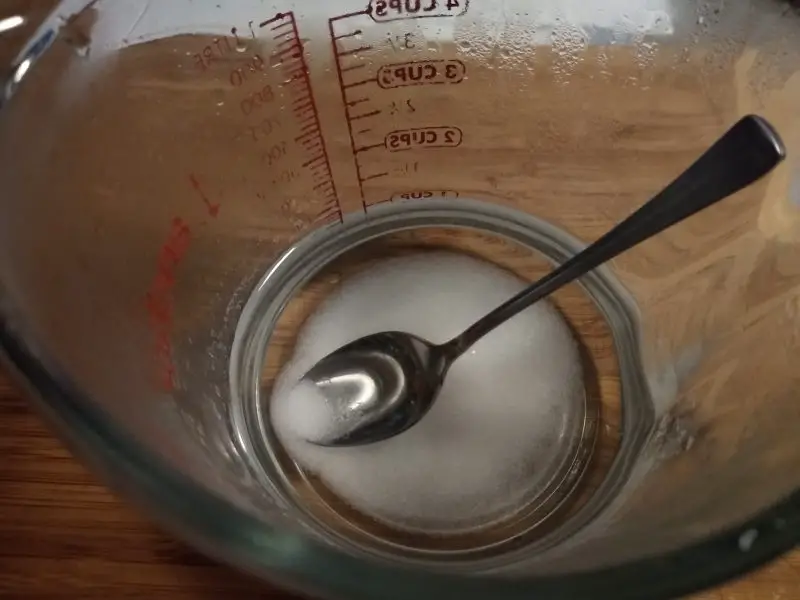 dissolve pickling salt in two cups of hot water
