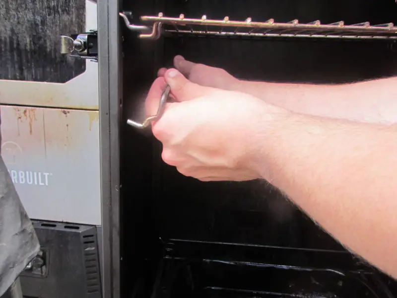 How do I adjust my Masterbuilt Propane Smoker Grates