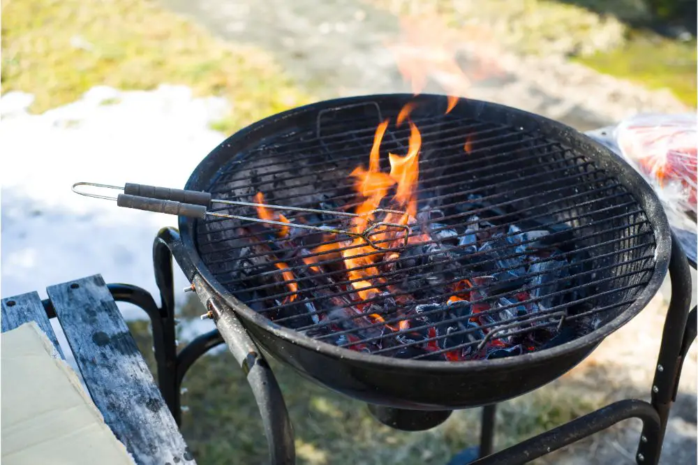 charcoal grill and charcoal tong