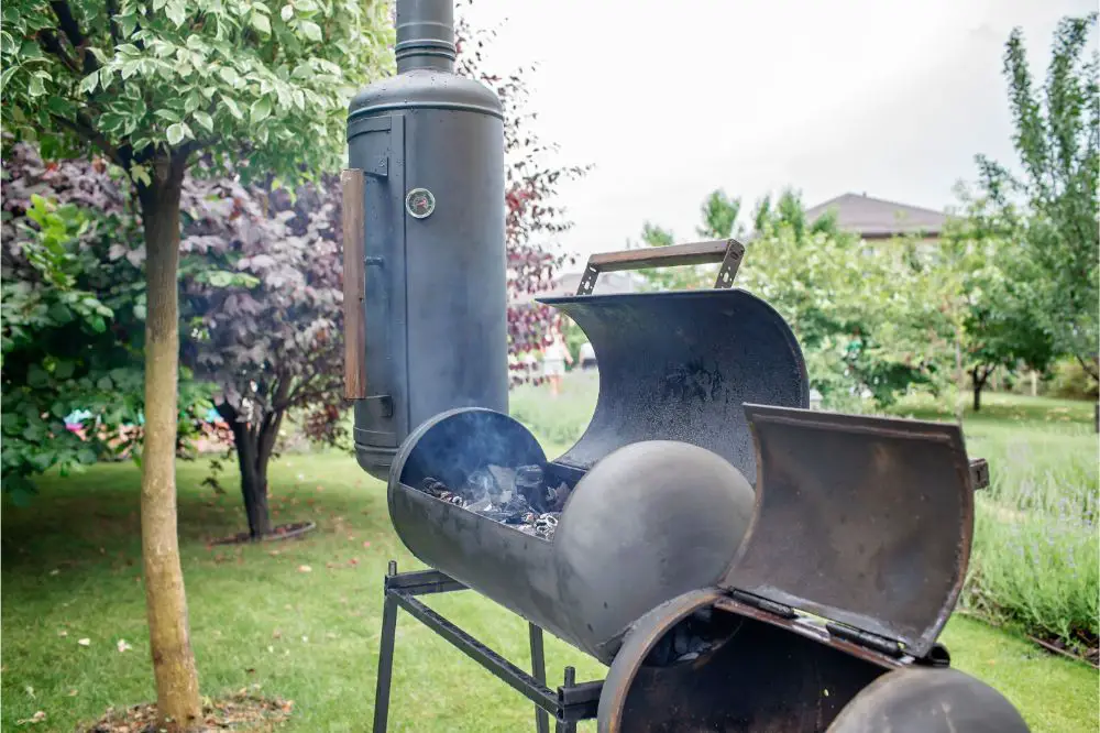 smoke coming out of a smokestack, barbecue on green background