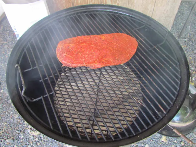 Adding The Food To The Weber Smokey Mountain Cooker