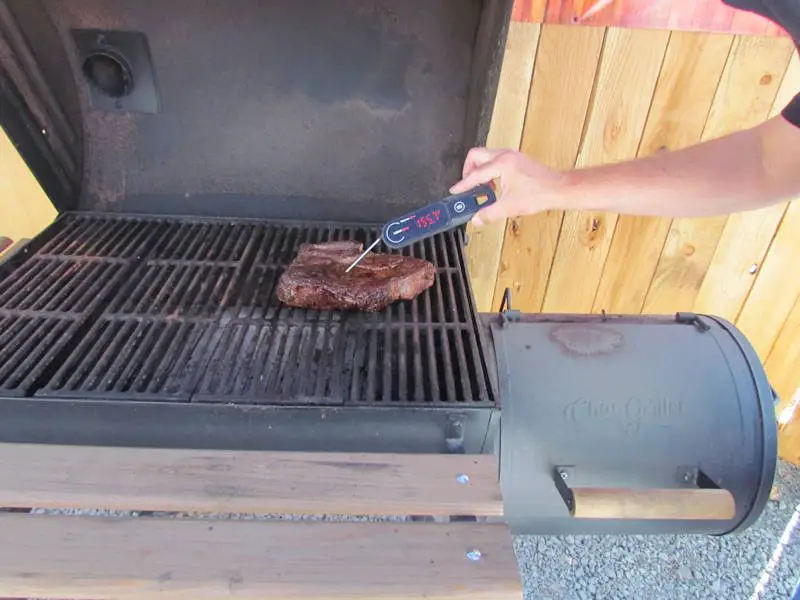 Robert checks the internal temperature of a small chuckroast with a thermopro lighning instant read thermometer
