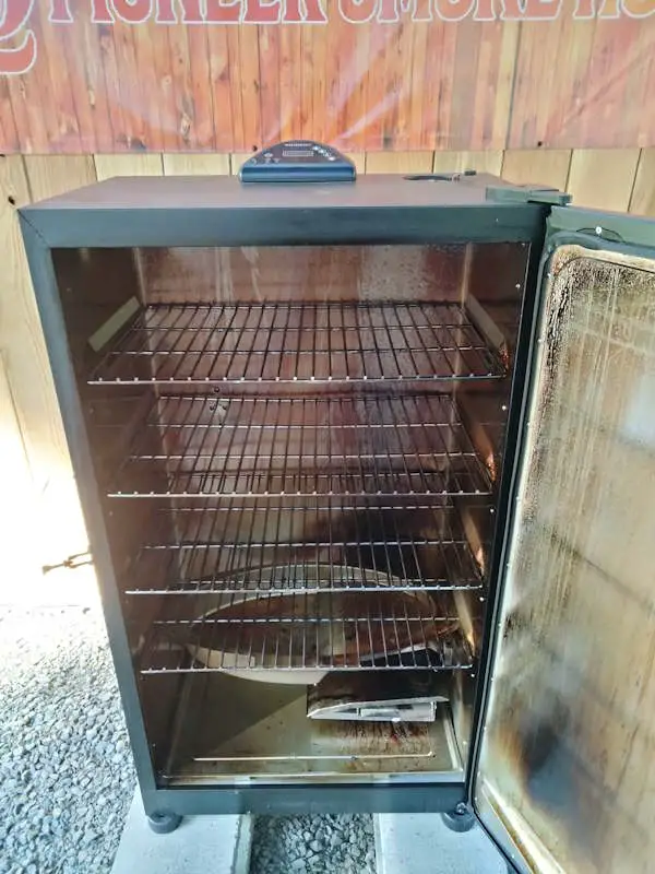 The inside of the Masterbuilt Electric Smoker is shown while being reviewed by Pioneer Smoke Houses.