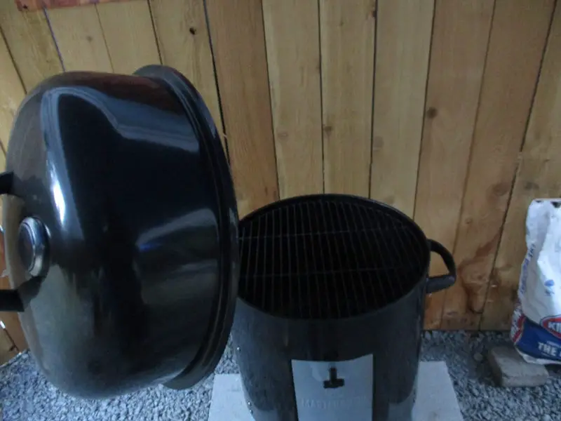 Taking a look inside the Masterbuilt Charcoal Bullet Smoker to check out the top grate
